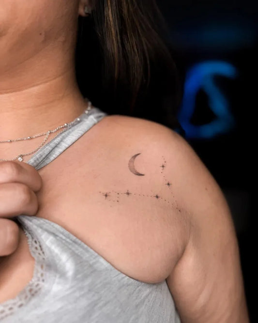 Small Minimalist Crescent Moon and Stars on Women Shoulder Tattoo by @dcink.tattoo