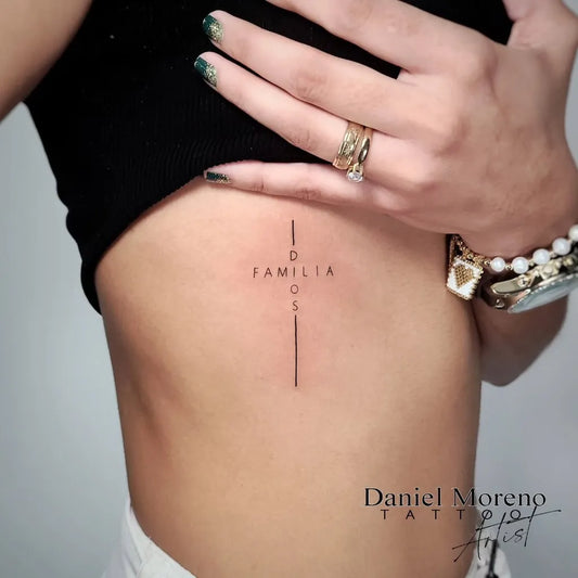 Small Minimalist Cross Familia on Women Rib Tattoo by @evild4n
