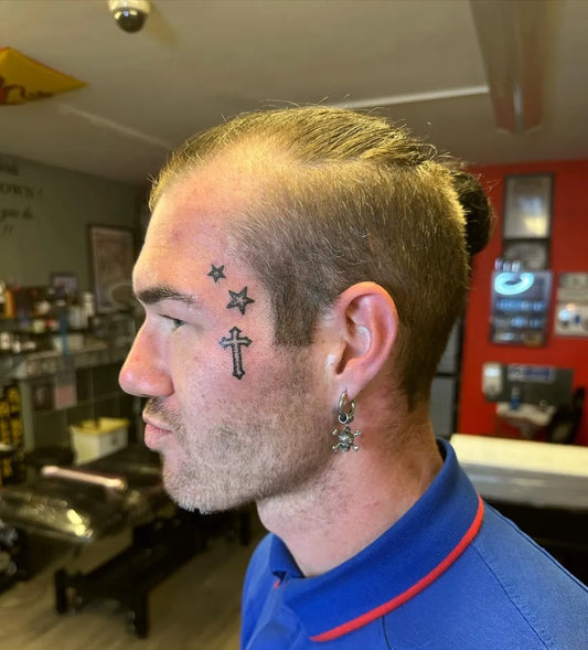 Small Minimalist Cross Stars on Men Face Tattoo by @jennifermcglynn666tattoos
