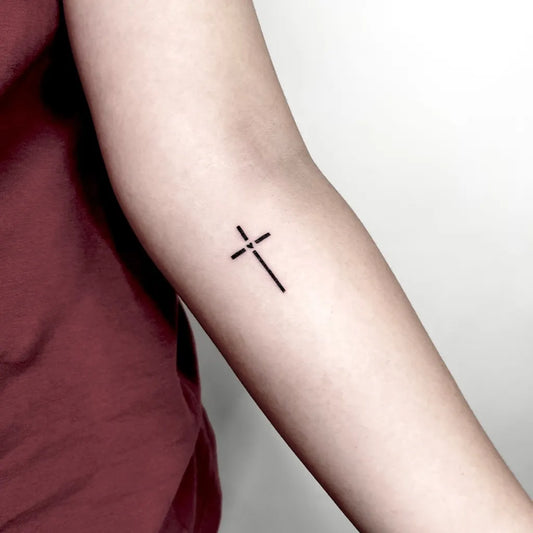 Small Minimalist Cross on Women Arm Tattoo by @tirta_arutalatattoo