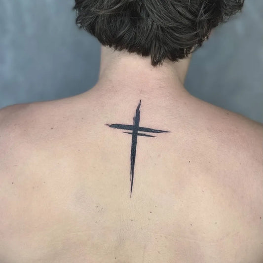 Small Minimalist Cross on Women Back Tattoo by @evolve_tattoocanggu