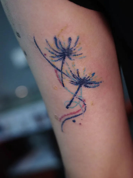 Small Minimalist Dandelion Tattoo on Women Arm by @rui_tattooartist
