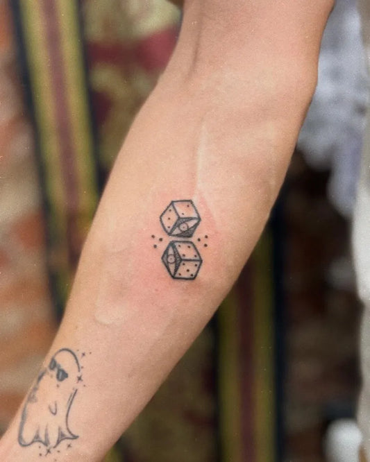 Small Minimalist Dice Tattoo on Women Arm by @rlewisart.tattooer