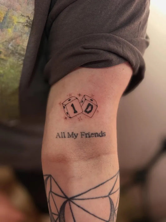 Small Minimalist Dice and Text on Men Arm Tattoo by @blyss.tattoo
