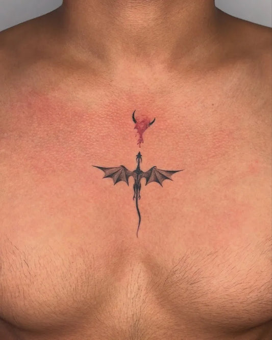 Small Minimalist Dragon and Baby Dragon on Men Chest Tattoo by @warkrafttattoostudio