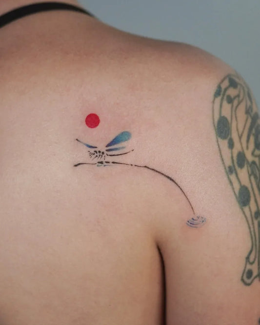 Small Minimalist Dragonfly with Sun and Ripples on Women Back Tattoo by @solar.ink.the.sky