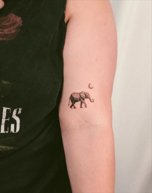 Small Minimalist Elephant and Crescent Moon Tattoo on Women Arm by @thisisheize