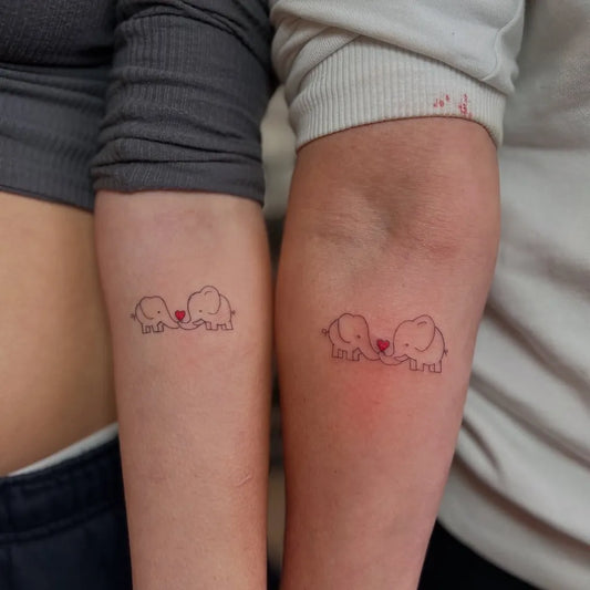 Small Minimalist Elephants on Couple on Arms Matching Tattoo by @kaden_tatatau