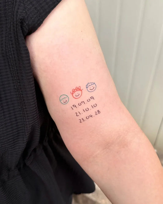 Small Minimalist Emojis and Dates Family Tattoo on Women Arm by @bora_tattooer