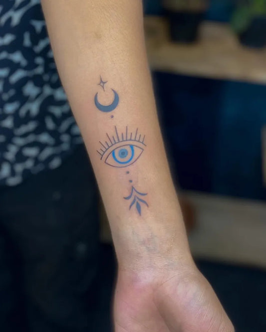 Small Minimalist Evil Eye Moon Arrow on Women Forearm Tattoo by @tattoo__point_ottapalam