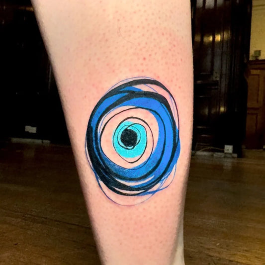 Small Minimalist Evil Eye on Women Leg Tattoo by @dbishoptattoo