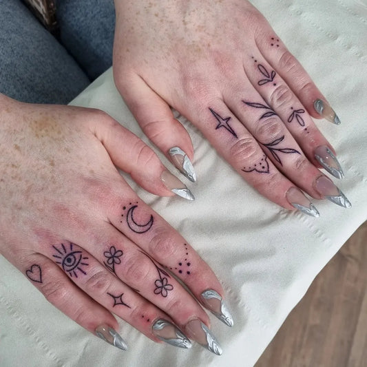 Small Minimalist Eye Moon Flowers on Women Fingers Tattoo by @shelbyrosetattoo