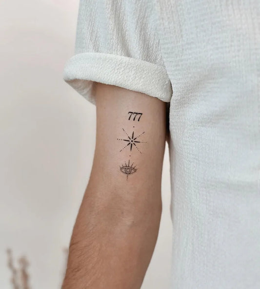 Small Minimalist Eye Star Numbers on Men Arm Tattoo by @cha.tattoo