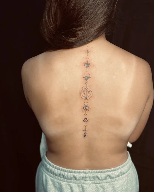Small Minimalist Eye Symbols on Women Spine Tattoo by @g_ladyg