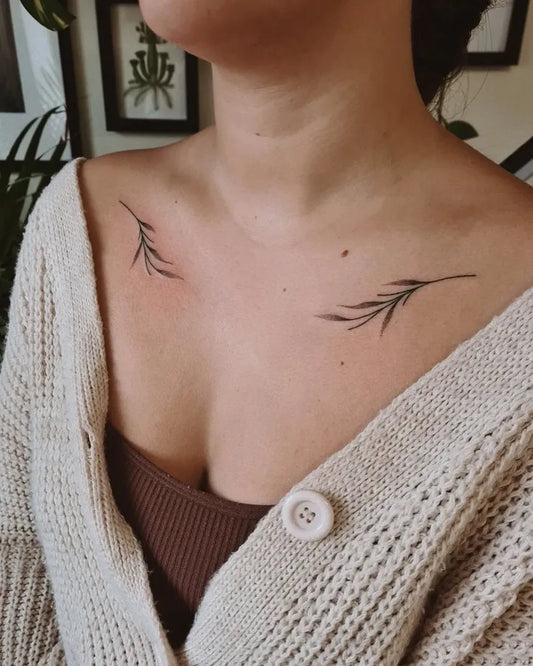 Small Minimalist Feather Tattoo on Women Collarbone by @sunshinelaburnum
