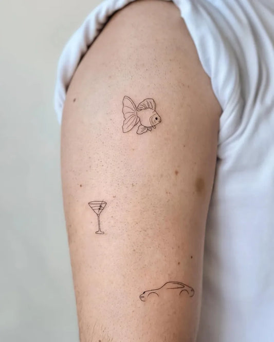 Small Minimalist Fish Martini Car on Women Arm Tattoo by @cha.tattoo