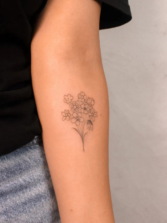 Small Minimalist Flower Bunch on Women Arm Flower Tattoo by @bb.tattoo.art