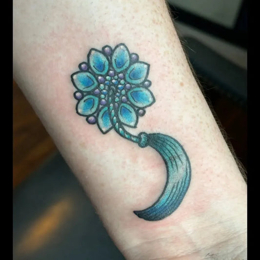 Small Minimalist Flower Semicolon Tassel on Women Arm Tattoo by @kyleandaburlyqhat