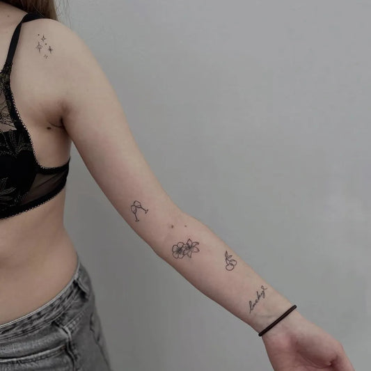 Small Minimalist Flowers Bicycle Script on Women Arm Tattoo by @scorpio.mechelen