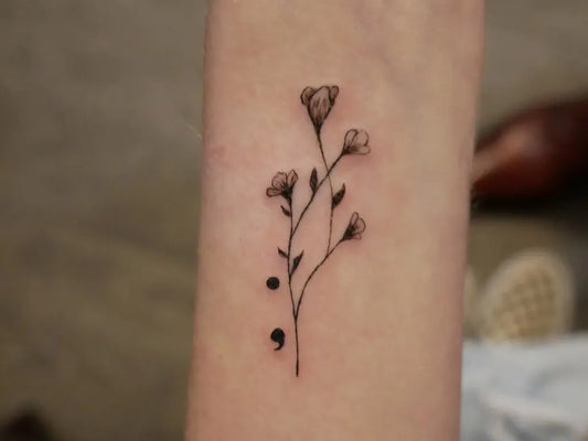 Small Minimalist Flowers and Semicolon on Women Wrist Tattoo by @rudrainktattoo
