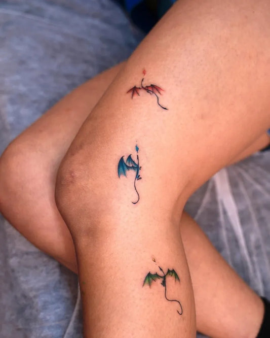 Small Minimalist Flying Dragons on Women Leg Tattoo by @txttoo