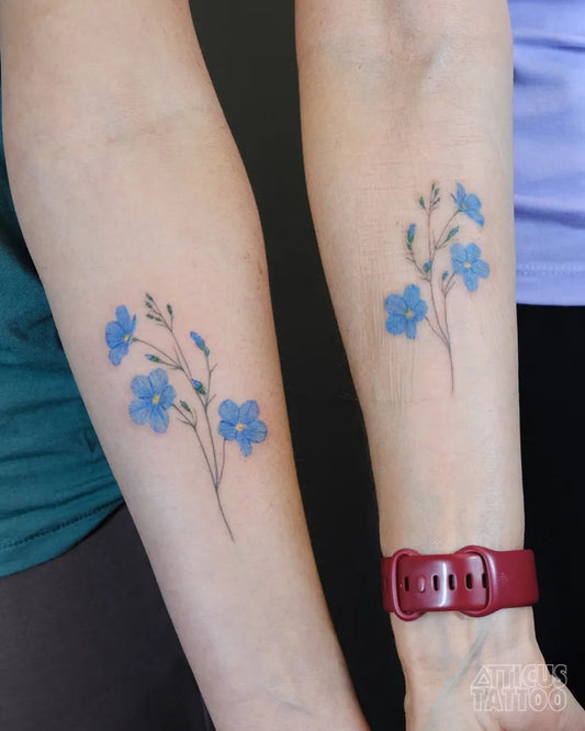 Small Minimalist Forgot Me Not Flowers on Friends Arms Matching Tattoo by @atticustattoo