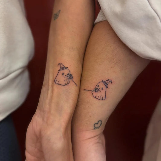 Small Minimalist Ghost Wizards on Couple Arms Matching Tattoo by @alien_ink_tattoo