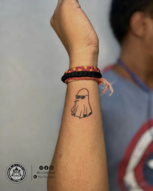 Small Minimalist Ghost with Sunglasses Tattoo on Men Wrist by @m.ainktattooz