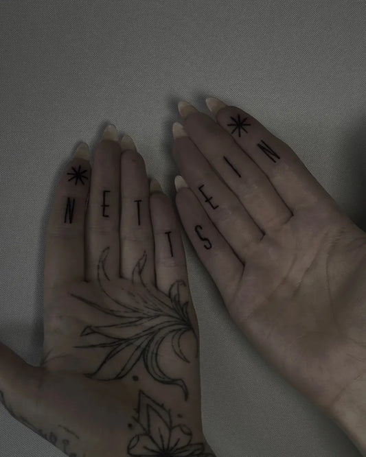 Small Minimalist Handwriting and Flower on Women Fingers Tattoo by @estherlilithtattoo