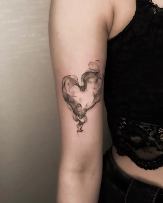 Small Minimalist Heart Smoke on Women Arm Tattoo by @hazetattooist