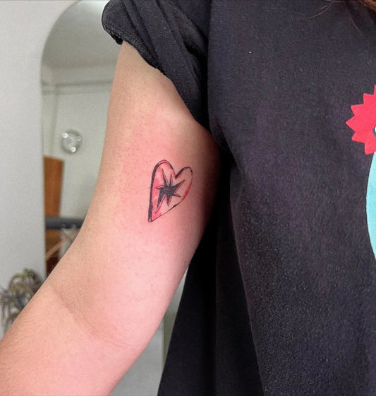 Small Minimalist Heart Star on Women Arm Tattoo by @nothin.tooit
