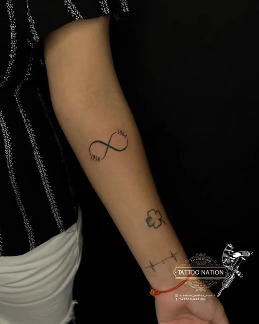 Small Minimalist Infinity Clover Dots Tattoo on Women Arm by @tattoo_nation_studio