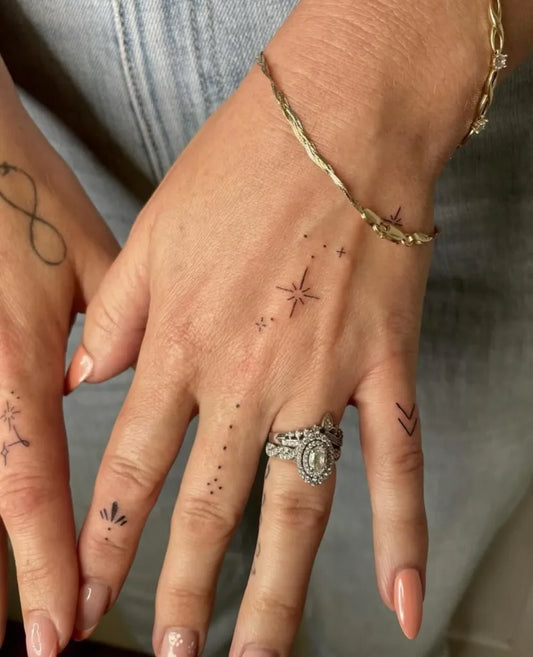 Small Minimalist Infinity Stars Dots on Women Fingers Tattoo by @timeless_tattoo_company