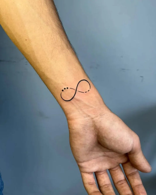 Small Minimalist Infinity Symbol Tattoo on Men Wrist by @art_by_ritik06