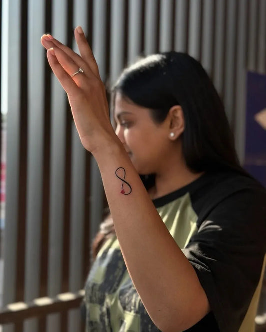 Small Minimalist Infinity Symbol Tattoo on Women Wrist by @khushi_tattoo2612