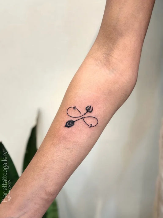 Small Minimalist Infinity Trishul Tattoo on Women Forearm by @gaurav_patil77
