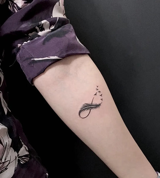 Small Minimalist Infinity with Birds Tattoo on Women Arm by @_zedtattoo