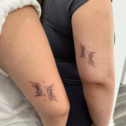 Small Minimalist Koi Fish on Friends on Arms Matching Tattoo by @inksirenstudio