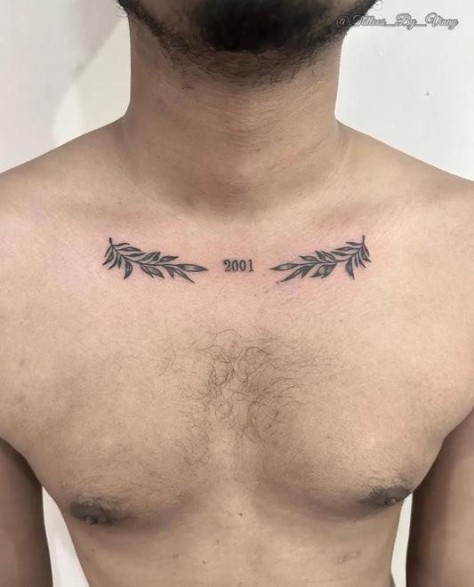 Small Minimalist Laurel Wreath with Date Tattoo on Men Chest by @vinay_dut