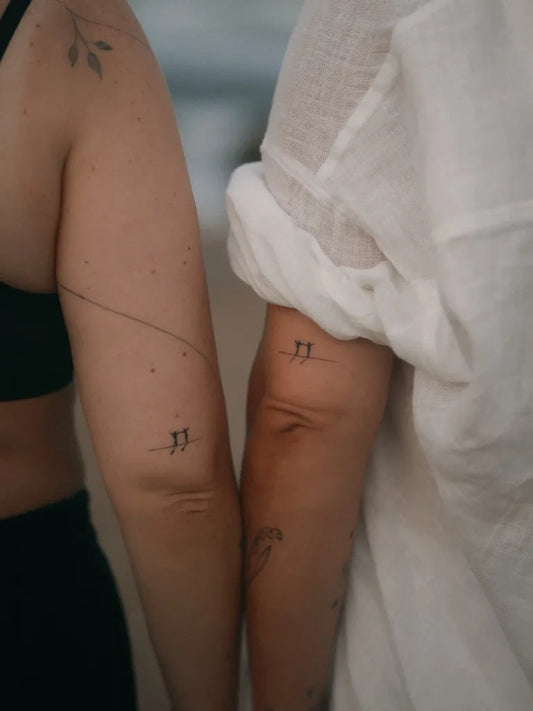 Small Minimalist Leaves and Lines on Couple Arms Matching Tattoo by @mint.brain.tattoo