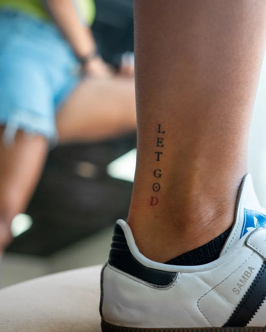Small Minimalist Let Go Text on Women Ankle Tattoo by @karl_thetattoo_plug