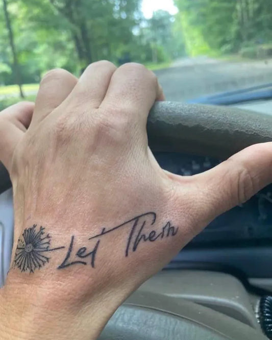 Small Minimalist Let Them Dahlia on Men Hand Tattoo by @lobsterladytalina
