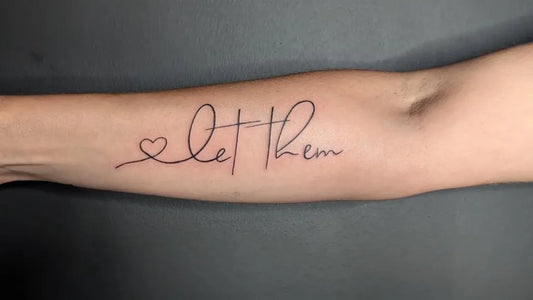 Small Minimalist Let Them Heart on Women Arm Tattoo by @taytertottattoos