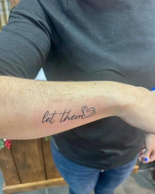 Small Minimalist Let Them Heart on Women Forearm Tattoo by @gordontshepherd