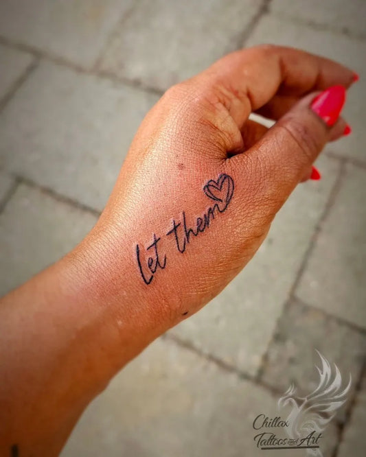 Small Minimalist Let Them Heart on Women Wrist Tattoo by @anita_autar