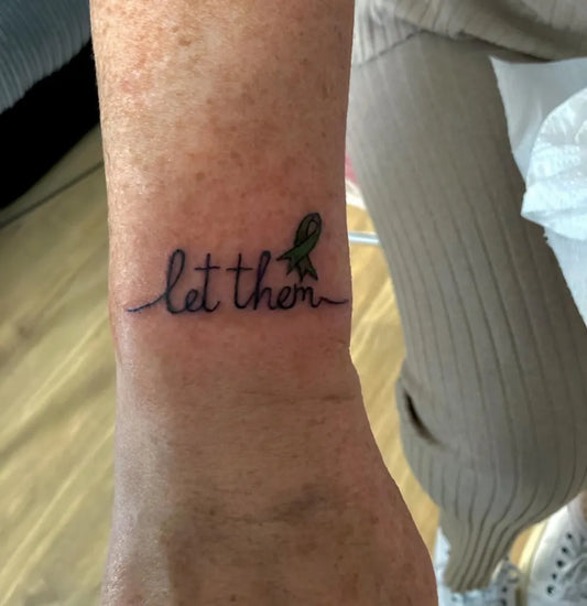 Small Minimalist Let Them Ribbon on Women Wrist Tattoo by @vickyreedtattoosandart_