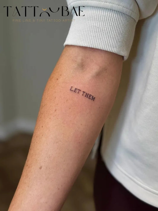 Small Minimalist Let Them Text on Women Arm Tattoo by @tattoobaemcr