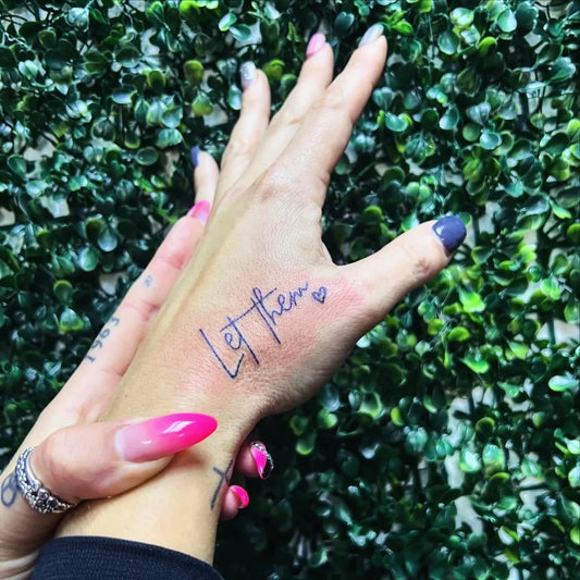 Small Minimalist Let Them Text on Women Hand Tattoo by @mjsink
