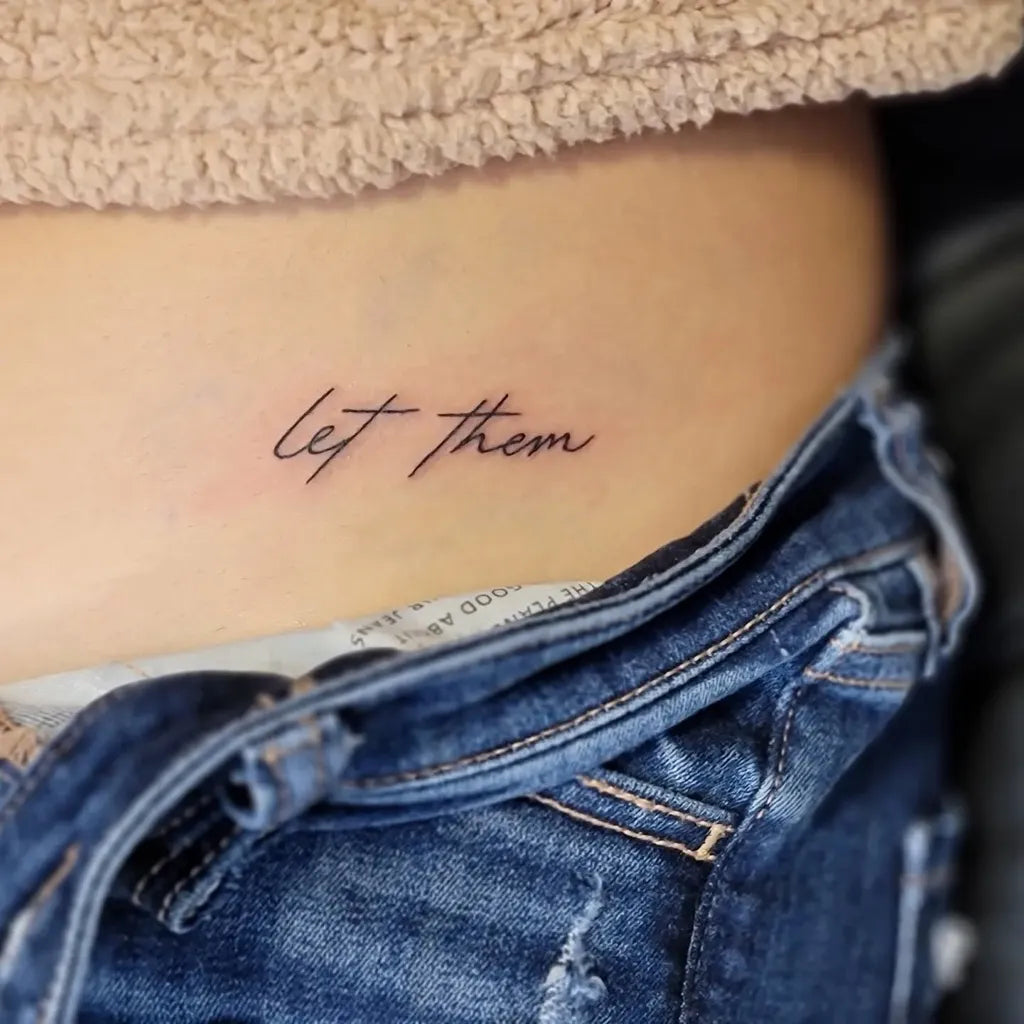 Small Minimalist Let Them on Women Hip Tattoo by @kush_tattoos