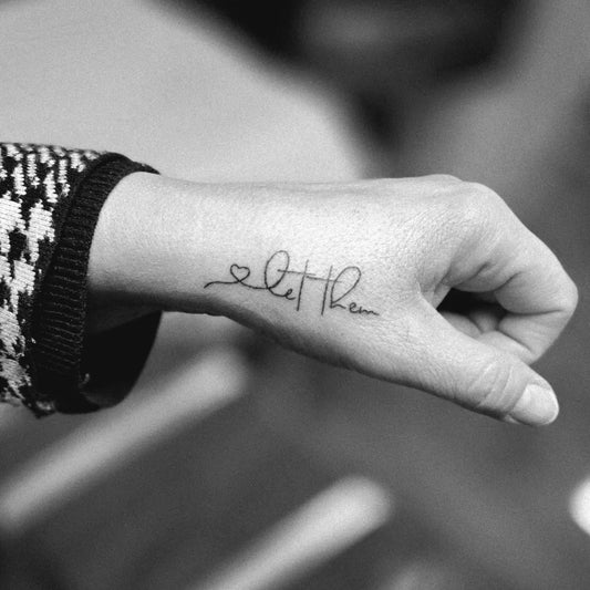Small Minimalist Let Them on Women Wrist Tattoo by @dopeasart